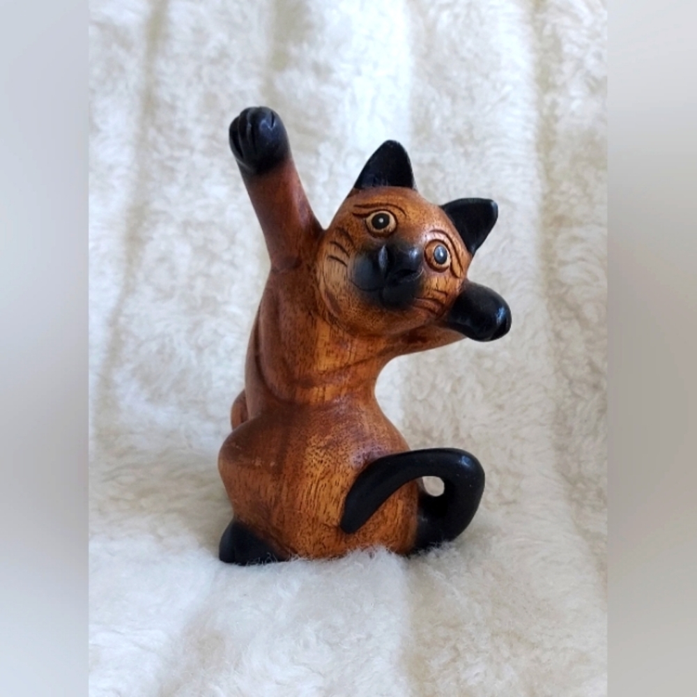 Hand carved 6.5-inch playful cat.